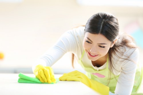 Professional carpet cleaners treating a busy room in Wormwood Scrubs